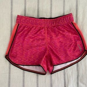 Pink athletic running shorts.